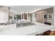 This contemporary kitchen features stainless appliances, a cooktop island and an eat-in breakfast nook at 10658 E Cinnabar Ave, Scottsdale, AZ 85258