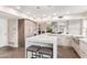 Modern kitchen features stainless appliances, a cooktop island and an eat-in breakfast nook at 10658 E Cinnabar Ave, Scottsdale, AZ 85258