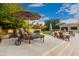 Multiple seating areas offer plenty of space for relaxation and entertaining on this tiered outdoor patio at 10658 E Cinnabar Ave, Scottsdale, AZ 85258