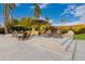 Outdoor entertaining space with gas fire pit, tiered patio, and comfortable seating, perfect for relaxing at 10658 E Cinnabar Ave, Scottsdale, AZ 85258