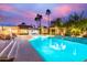 Sparkling pool with outdoor seating and lush landscaping, creating a private oasis at 10658 E Cinnabar Ave, Scottsdale, AZ 85258