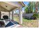 Covered patio overlooking a well-maintained lawn, and surrounded by a block wall for privacy at 12107 N 66Th Ave, Glendale, AZ 85304