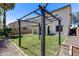 Spacious backyard featuring a well-maintained lawn and a charming pergola, perfect for outdoor relaxation and entertainment at 12107 N 66Th Ave, Glendale, AZ 85304