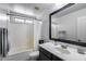 Updated bathroom featuring a shower-tub combo, vanity sink, and classic fixtures at 12107 N 66Th Ave, Glendale, AZ 85304