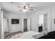 Bright bedroom has a ceiling fan, and an ensuite bathroom at 12107 N 66Th Ave, Glendale, AZ 85304