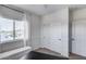 Bedroom with natural light, closet, door and versatile bench seating at 12107 N 66Th Ave, Glendale, AZ 85304