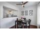 Open dining area featuring a dark wood table set and view to the kitchen at 12107 N 66Th Ave, Glendale, AZ 85304