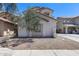 Charming single-Gathering home with a tidy gravel yard, mature trees, and a clean, well-maintained exterior at 12107 N 66Th Ave, Glendale, AZ 85304