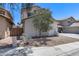 Well-maintained home featuring a gravel yard, mature trees and an orderly exterior, creating a welcoming curb appeal at 12107 N 66Th Ave, Glendale, AZ 85304
