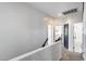 Hallway features neutral carpet, white walls, and a view to a bedroom at 12107 N 66Th Ave, Glendale, AZ 85304