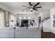 Spacious living room features a comfortable gray sectional, dark hardwood floors, and modern decor at 12107 N 66Th Ave, Glendale, AZ 85304