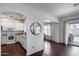 The living room area leads to a quaint kitchen and sliding door exit at 12107 N 66Th Ave, Glendale, AZ 85304