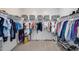 Spacious walk-in closet provides ample storage solutions for clothes and accessories at 12107 N 66Th Ave, Glendale, AZ 85304