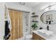 Bathroom featuring a tub, shower, and wooden vanity with a vessel sink at 13621 N 98Th Ave # E, Sun City, AZ 85351
