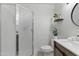 Modern bathroom with a glass enclosed shower and white vanity at 13621 N 98Th Ave # E, Sun City, AZ 85351