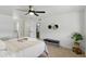 Bright bedroom with ceiling fan, carpet and ensuite bath and walk-in closet at 13621 N 98Th Ave # E, Sun City, AZ 85351