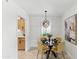 Inviting dining room featuring a modern chandelier, elegant table setting, and stylish decor at 13621 N 98Th Ave # E, Sun City, AZ 85351