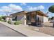 Inviting single-story home with tidy landscaping, featuring a welcoming screened-in front porch at 13621 N 98Th Ave # E, Sun City, AZ 85351