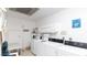 Laundry room with multiple washing machines and dryers for resident use at 13621 N 98Th Ave # E, Sun City, AZ 85351