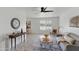 Bright living room features a ceiling fan, neutral decor and modern furnishings at 13621 N 98Th Ave # E, Sun City, AZ 85351