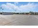 Exterior view of complex with large parking lot at 13621 N 98Th Ave # E, Sun City, AZ 85351