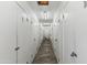 Indoor storage unit hallway featuring rows of white metal doors with unit numbers at 13621 N 98Th Ave # E, Sun City, AZ 85351