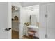 Vanity area featuring a makeup mirror, drawers, and cabinets, located next to the closet at 13621 N 98Th Ave # E, Sun City, AZ 85351