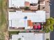 Aerial view of home showing covered patio with outdoor seating, backyard with artificial turf, and red umbrellas at 14247 N 2Nd Ave, Phoenix, AZ 85023