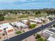 Picturesque aerial view of homes situated next to a golf course, set against a backdrop of desert landscape at 14247 N 2Nd Ave, Phoenix, AZ 85023