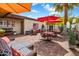 Exterior space offering several seating arrangements, shade umbrellas, and lots of lounging possibilities at 14247 N 2Nd Ave, Phoenix, AZ 85023