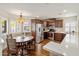 Kitchen with wood cabinets, stainless appliances, hard wood floors, and a breakfast nook with large window at 14247 N 2Nd Ave, Phoenix, AZ 85023