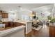 Open concept kitchen with stainless appliances, stone countertops, hardwood floors, and seamless flow at 14247 N 2Nd Ave, Phoenix, AZ 85023