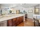 Well-lit kitchen with stainless appliances, quartz countertops, and an open layout with seamless flow at 14247 N 2Nd Ave, Phoenix, AZ 85023