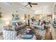 Bright living room boasts vaulted ceilings, clerestory windows, hardwood floors, and cozy seating at 14247 N 2Nd Ave, Phoenix, AZ 85023