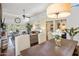 Open-concept layout featuring hard wood floors and seamless access to kitchen, living, and dining areas at 14247 N 2Nd Ave, Phoenix, AZ 85023