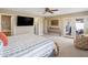 Spacious main bedroom with patio access, walk-in closet, and ensuite bathroom at 14247 N 2Nd Ave, Phoenix, AZ 85023
