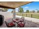 Inviting covered patio with comfortable seating and views of the lush golf course at 14247 N 2Nd Ave, Phoenix, AZ 85023