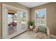 Comfortable sitting area offers views of the patio and lush landscaping at 14247 N 2Nd Ave, Phoenix, AZ 85023