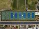 Aerial view of multiple well-maintained blue and green tennis courts perfect for sports enthusiasts, near lush landscaping at 14247 N 2Nd Ave, Phoenix, AZ 85023