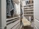 Organized closet with custom shelving for shoes, clothes, and accessories, plus a vanity at 14870 W Encanto Blvd # 2123, Goodyear, AZ 85395