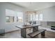 Modern dining area with unique lighting and stylish furnishings at 14870 W Encanto Blvd # 2123, Goodyear, AZ 85395