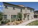Attractive home exterior with a well-kept lawn, tasteful landscaping, and inviting walkway at 14870 W Encanto Blvd # 2123, Goodyear, AZ 85395