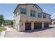 Exterior view showcasing the garages and architectural details of this beautifully designed home at 14870 W Encanto Blvd # 2123, Goodyear, AZ 85395