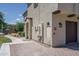 Exterior view of a charming home featuring a private garage and well-maintained landscaping at 14870 W Encanto Blvd # 2123, Goodyear, AZ 85395