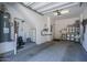 Spacious garage interior with ample storage space, a water heater, and a clean concrete floor at 14870 W Encanto Blvd # 2123, Goodyear, AZ 85395