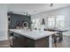 Open-concept kitchen featuring a large island with seating at 14870 W Encanto Blvd # 2123, Goodyear, AZ 85395