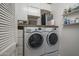 Modern laundry room with side-by-side washer and dryer and ample storage space at 14870 W Encanto Blvd # 2123, Goodyear, AZ 85395