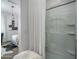 Bright main bedroom featuring plush carpets, ensuite bathroom, and stylish furnishings at 14870 W Encanto Blvd # 2123, Goodyear, AZ 85395
