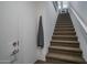 Carpeted stairway leading to the upper level of the modern townhouse at 14870 W Encanto Blvd # 2123, Goodyear, AZ 85395