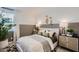 This bedroom boasts unique decor, natural light through the window, and neutral tones at 15782 W Kendall St, Goodyear, AZ 85338